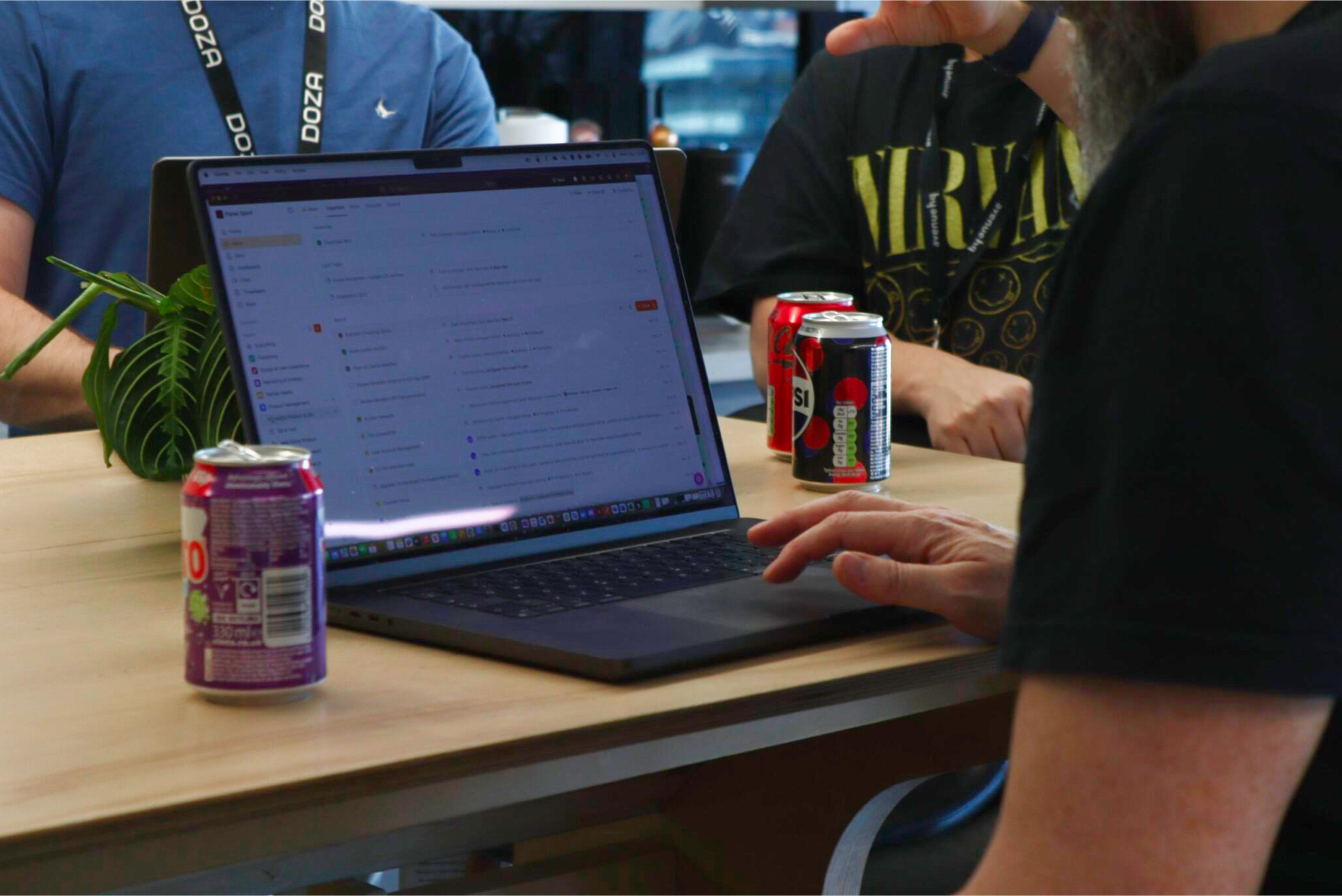 Image of person sitting working at a laptop
